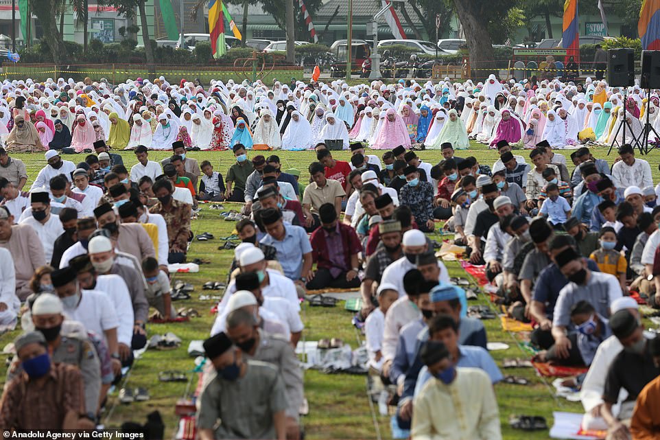MEDAN, INDONESIA: People wearing masks and prayer caps attend prayers at Merdeka Square in Binjai this morning