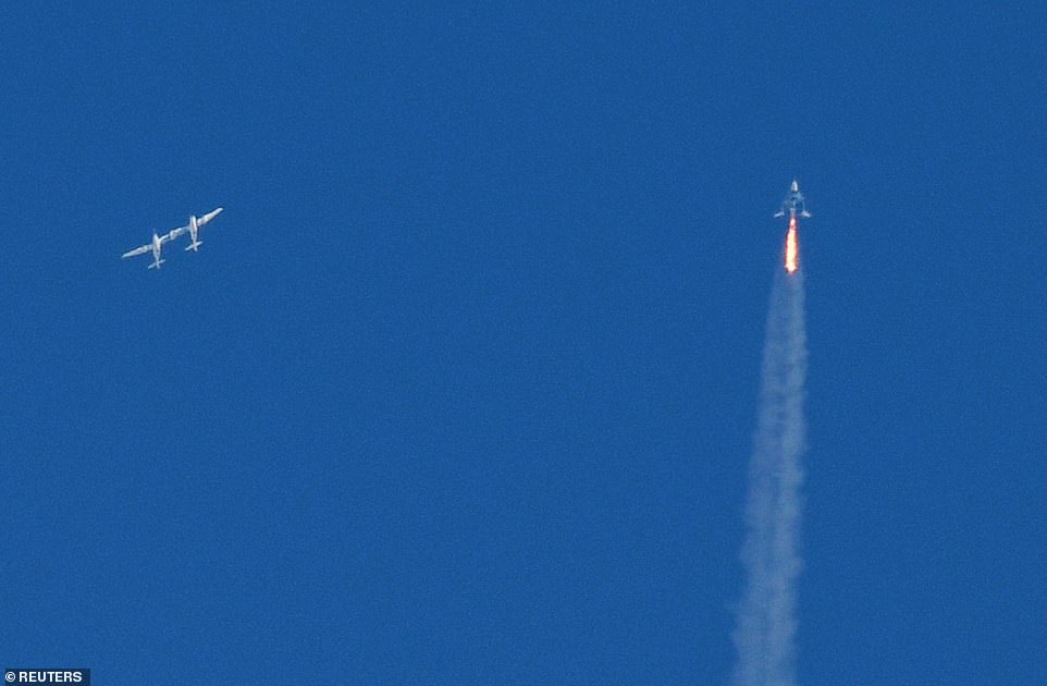 The SpaceShipTwo VSS Unity passenger craft (R) is seen after separation from Virgin Galactic rocket plane, the WhiteKnightTwo carrier airplane (L)