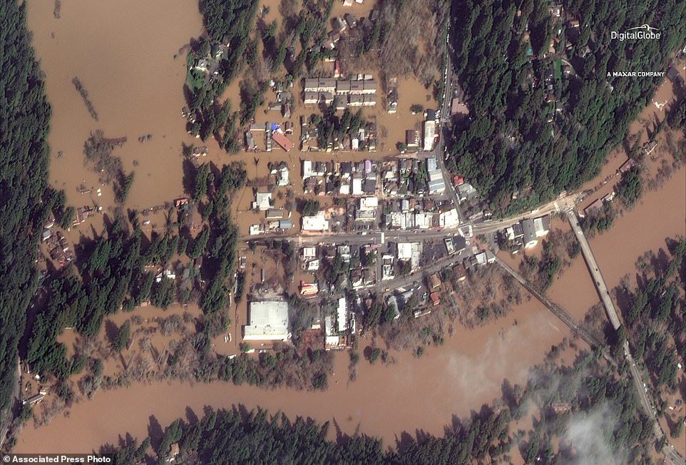 This satellite image from Thursday shows  Guerneville after the flood. Authorities have reopened the roads into two towns cut off for days by a rain-swollen river and residents and work crews have started cleaning up the muck left behind