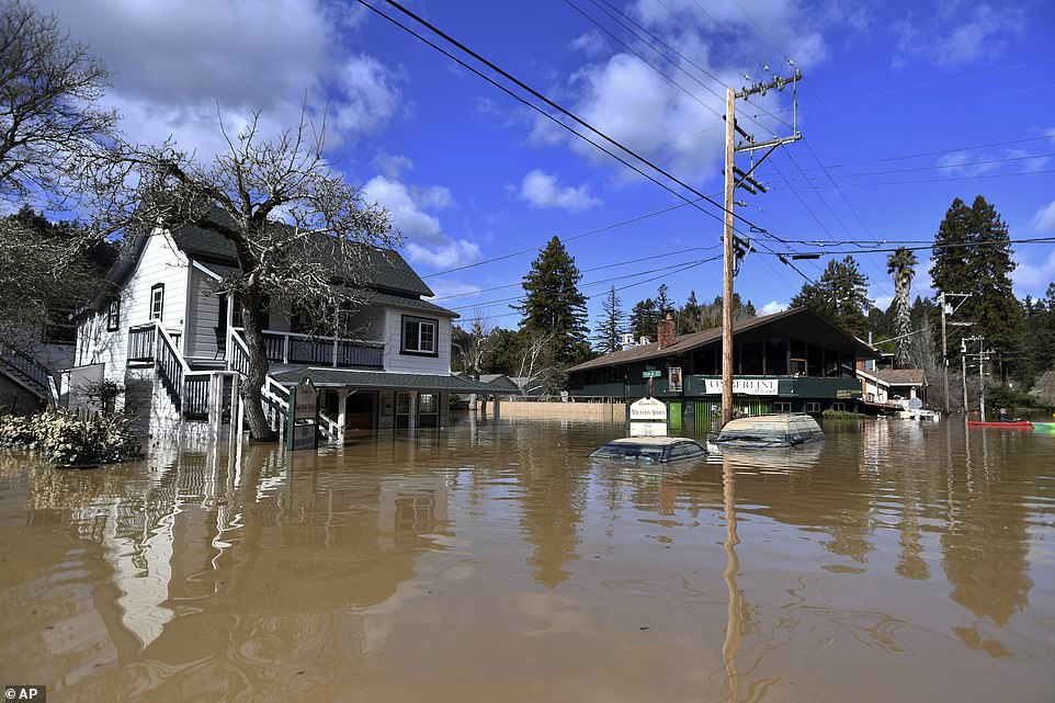 A flooded neighborhood sits in waters from the overflowed Russian River in the town of Guerneville