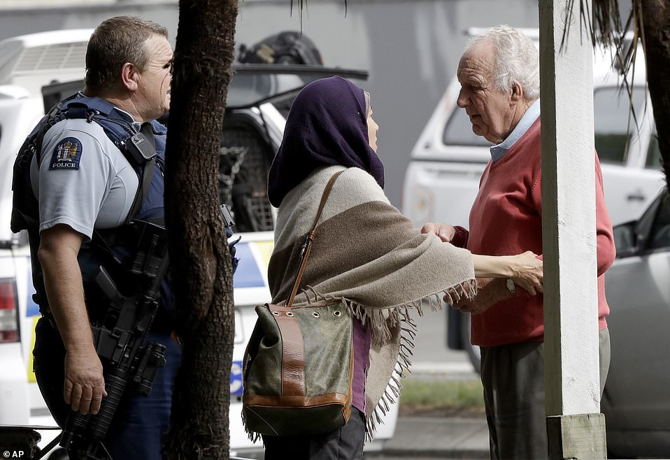 Police escort people away from outside one of the mosques targeted in the shooting. The massacre in Christchurch left 49 dead