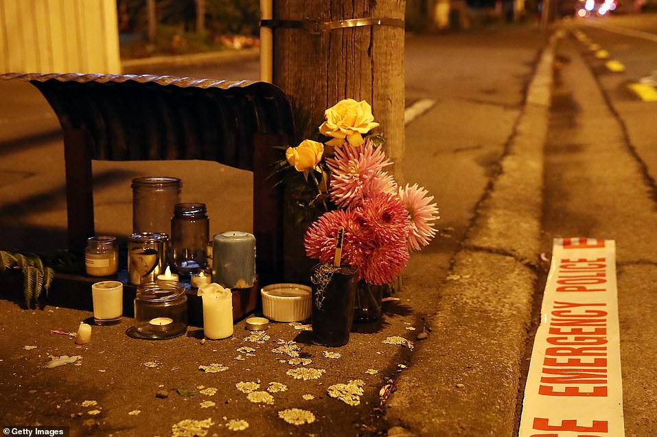 Floral tributes are left before dawn at Deans Avenue near the Al Noor Mosque on March 16, 2019 in Christchurch, New Zealand