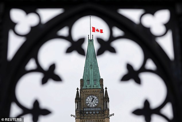 The Canadian flag flies at half-mast on the Peace Tower in memory of the victims of the mosque attacks in New Zealand