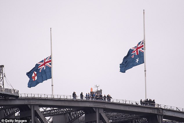 Flags fly at half mast on the Sydney Harbour Bridge