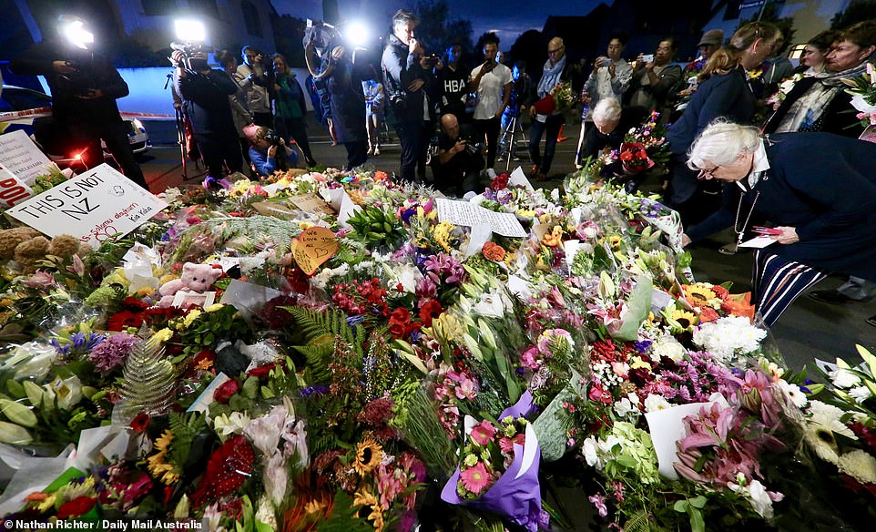 Notes left alongside floral tributes read 'This is not NZ' and 'we are one' and 'you are my friends, I will keep watch while you pray' as New Zealanders echoed their Prime Minister Jacinda Adhern. She said: 'These are people who I would describe as having extremist views that have absolutely no place in New Zealand and, in fact, have no place in the world'