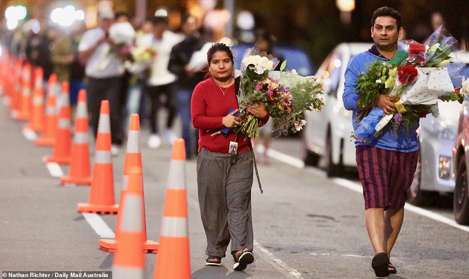 Those who gathered at the vigil helped to being the floral tributes closer to the mosques where 49 people lost their lives during the shooting