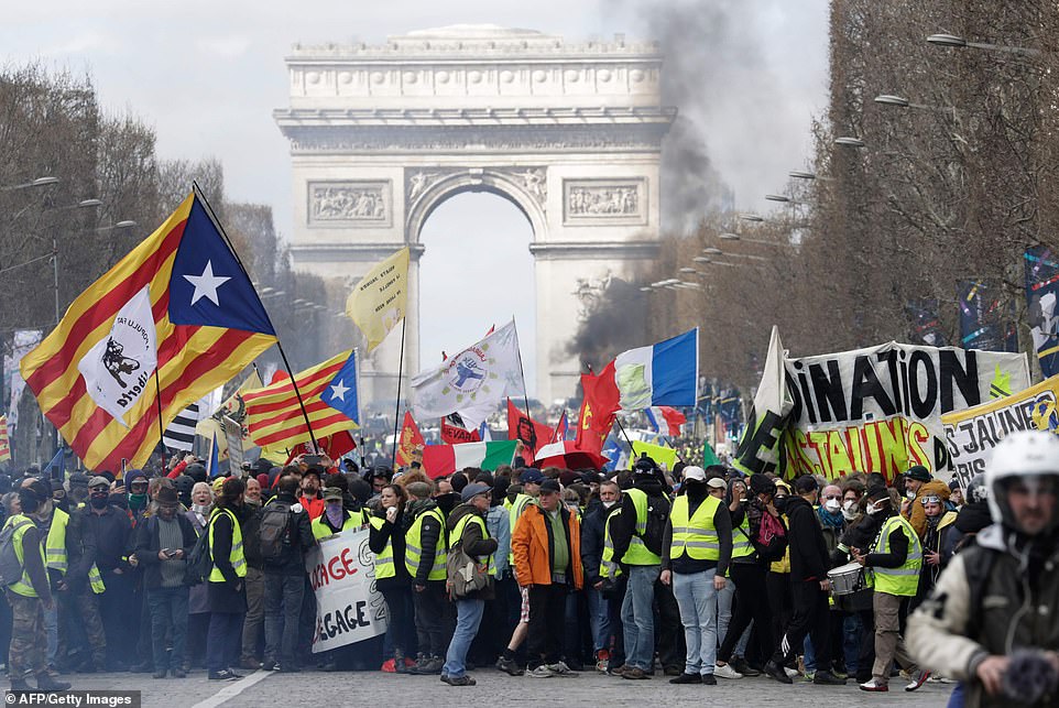 Violence erupted in Paris today as Yellow Vest protesters calling for French President Emmanuel Macron to resign took to the streets for the eighteenth Saturday in a row