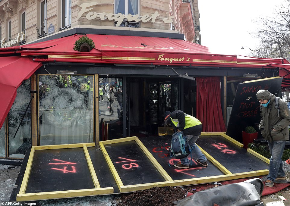 Exclusive restaurant Le Fouquet, popular with politicians and celebrities was also vandalised