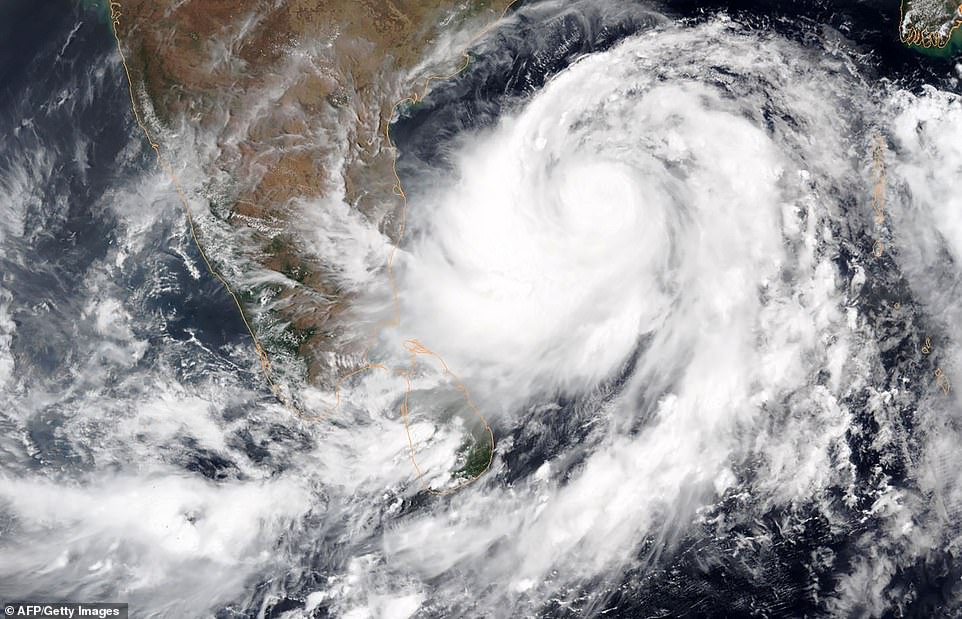 Threat: A satellite image from the National Oceanic and Atmospheric Administration Tropical Cyclone Fani intensifying in the Bay of Bengal yesterday