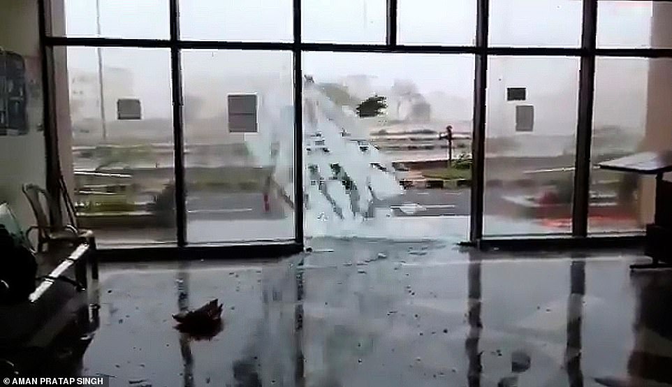 Shattered: A glass door smashes during Cyclone Fani in Bhubaneswar as authorities evacuate the homes of a million people amid fears of a storm surge