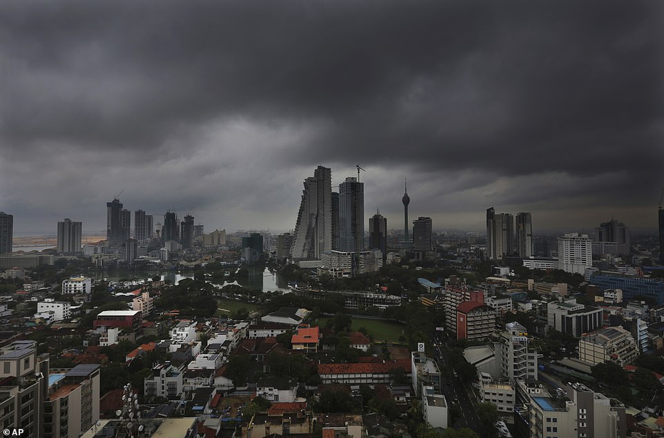 Dark clouds from a thunderstorm pass over Colombo, Sri Lanka, Tuesday, April 30, 2019, as warnings for the 'extremely severe' cyclone were issued in India