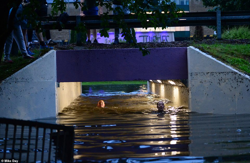 Earlier this morning, a pair of young girls were pictured swimming through a flooded underpass after torrential rain struck Stirling in Scotland this morning