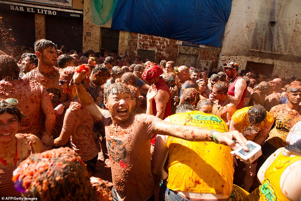 More than 20,000 people pelted each other with ripe tomatoes on Wednesday, in the latest edition of the annual festival