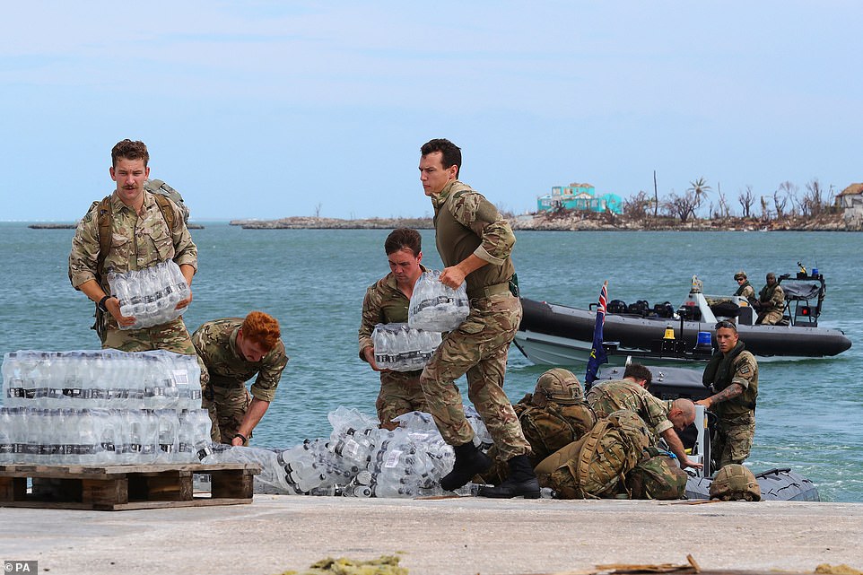 Humanitarian and Disaster Relief troops from Britain are seen delivering water to Abaco on Thursday
