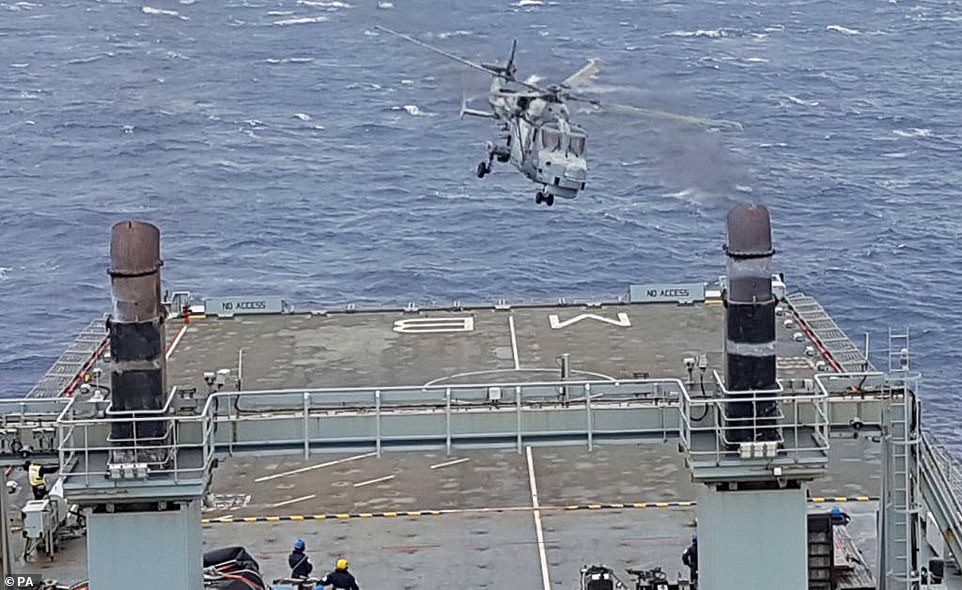 The photo above shows the Royal Navy Wildcat helicopter which helped rescue one Brit and three children who were trapped under rubble