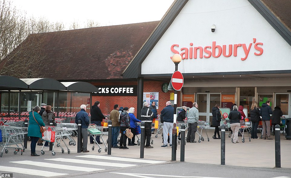 People queuing up outside Sainsburys in Guildford just two days after the Prime Minister encouraged people to stop panic buying