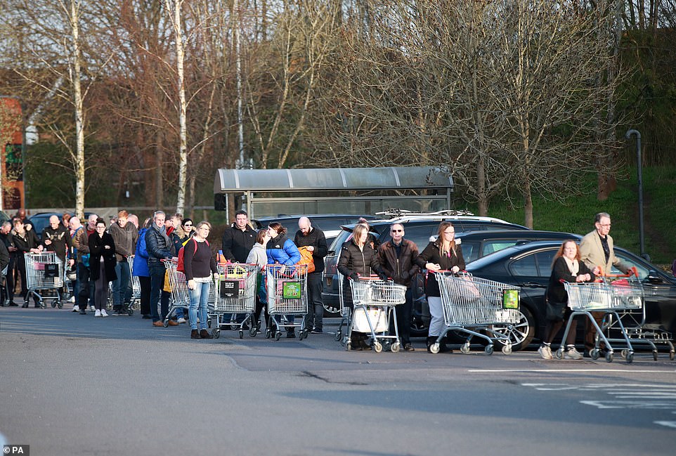 People queuing up outside Sainsburys in Guildford despite multiple warnings from the government about the harms of panic buying