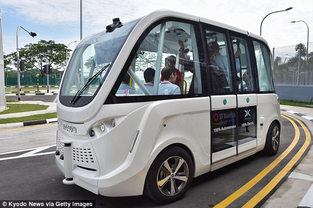 Driverless buses (pictured) will appear on some roads in Singapore from 2022 as part of plans to improve mobility in the land-scarce city-state, its transport minister has announced