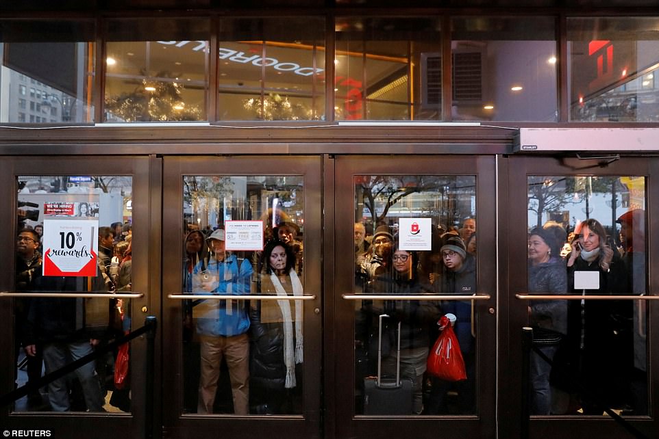 MANHATTAN: Eager shoppers were seen cramped against the store's doors as they waited patiently to get their hands on early Christmas gifts at Macy's in Herald Square on Thursday night 