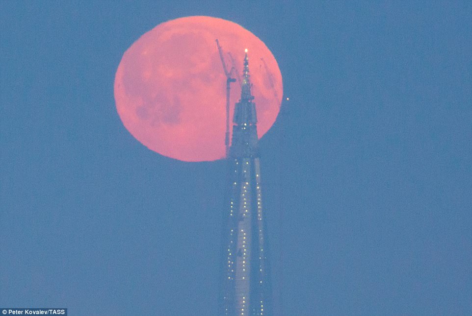 The moon will be much bigger and brighter than usual it will also be second full moon of the month, making it a blue moon. It might look similar to the orange-coloured super moon rising over the tower of the Lakhta Cente in St Petersburg this morning
