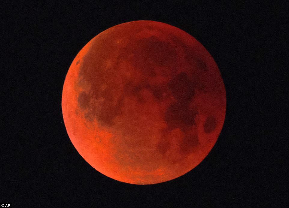 A super blue blood moon is seen over Los Angeles on Wednesday. NASA is calling it a lunar trifecta: the first super blue blood moon since 1982. That combination won't happen again until 2037
