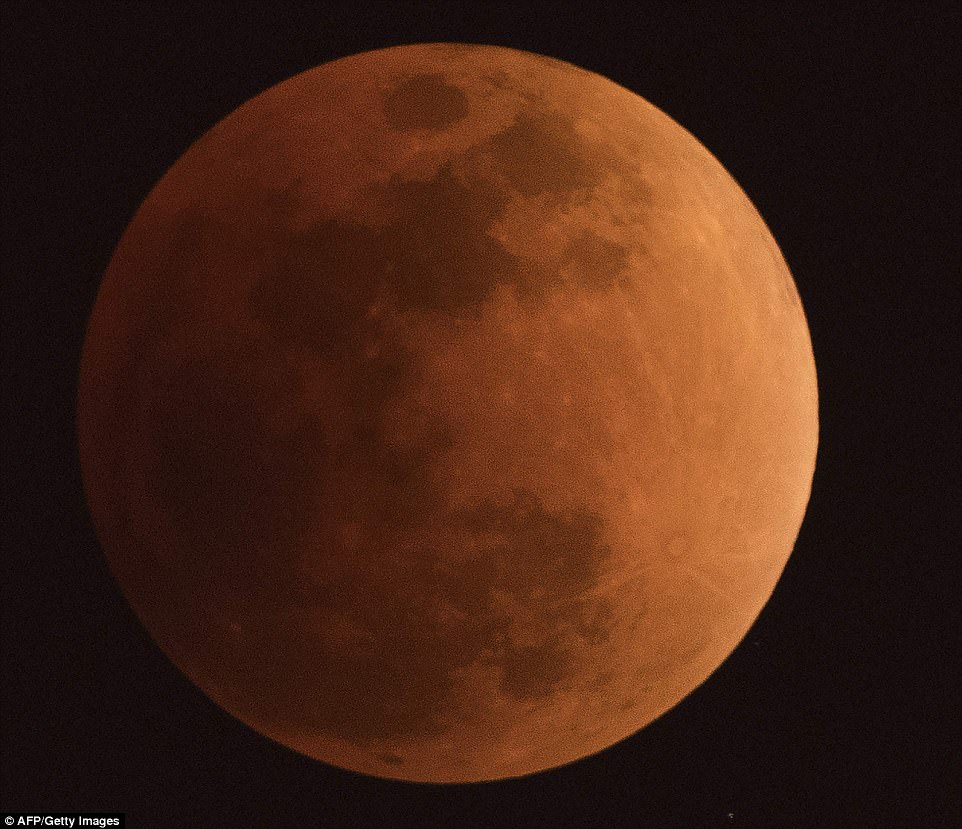 The moon is seen during a lunar eclipse, referred to as the "super blue blood moon", in Beijing 