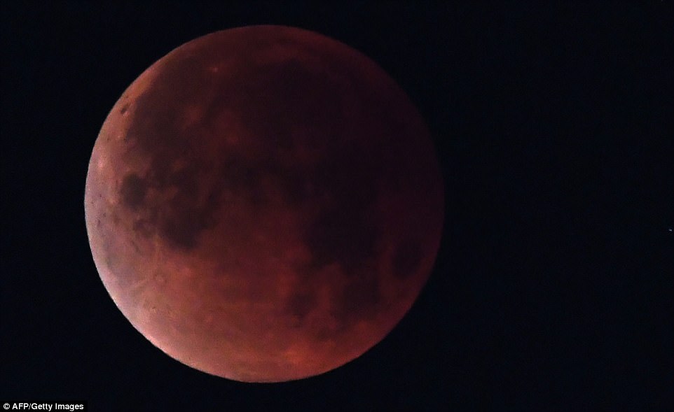  The 'super blue blood moon' is seen over Los Angeles, California, on January 31, 2018. Many parts of the globe may catch a glimpse on January 31 of a giant crimson moon, thanks to a rare lunar trifecta that combines a blue moon, a super moon and a lunar eclipse