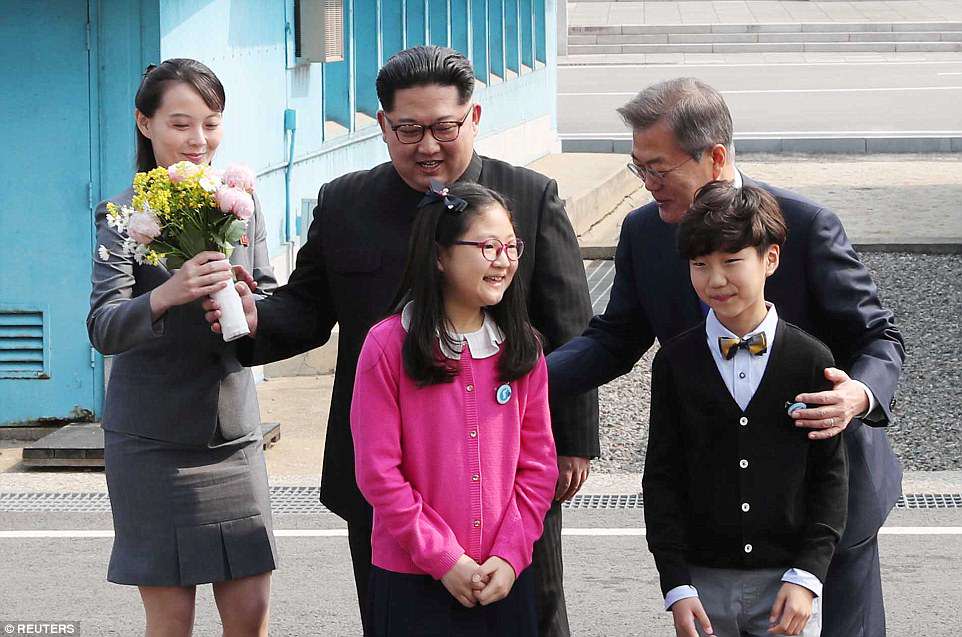 Two fifth-grade students from the Daesongdong Elementary School, the only South Korean school within the DMZ, greeted the leaders and gave Kim flowers