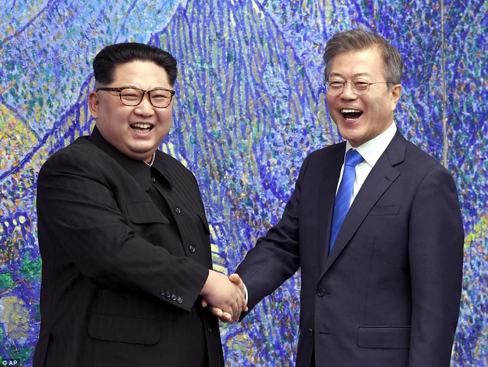 It was all smiles as North Korean dictator Kim Jong-un (left) and South Korean President Moon Jae-in shook hands and posed for photos inside the Peace House