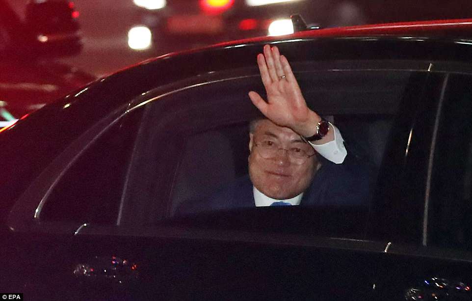 South Korean President Moon Jae-in waves from his car after his historic day of talks with Kim Jong-un on Friday