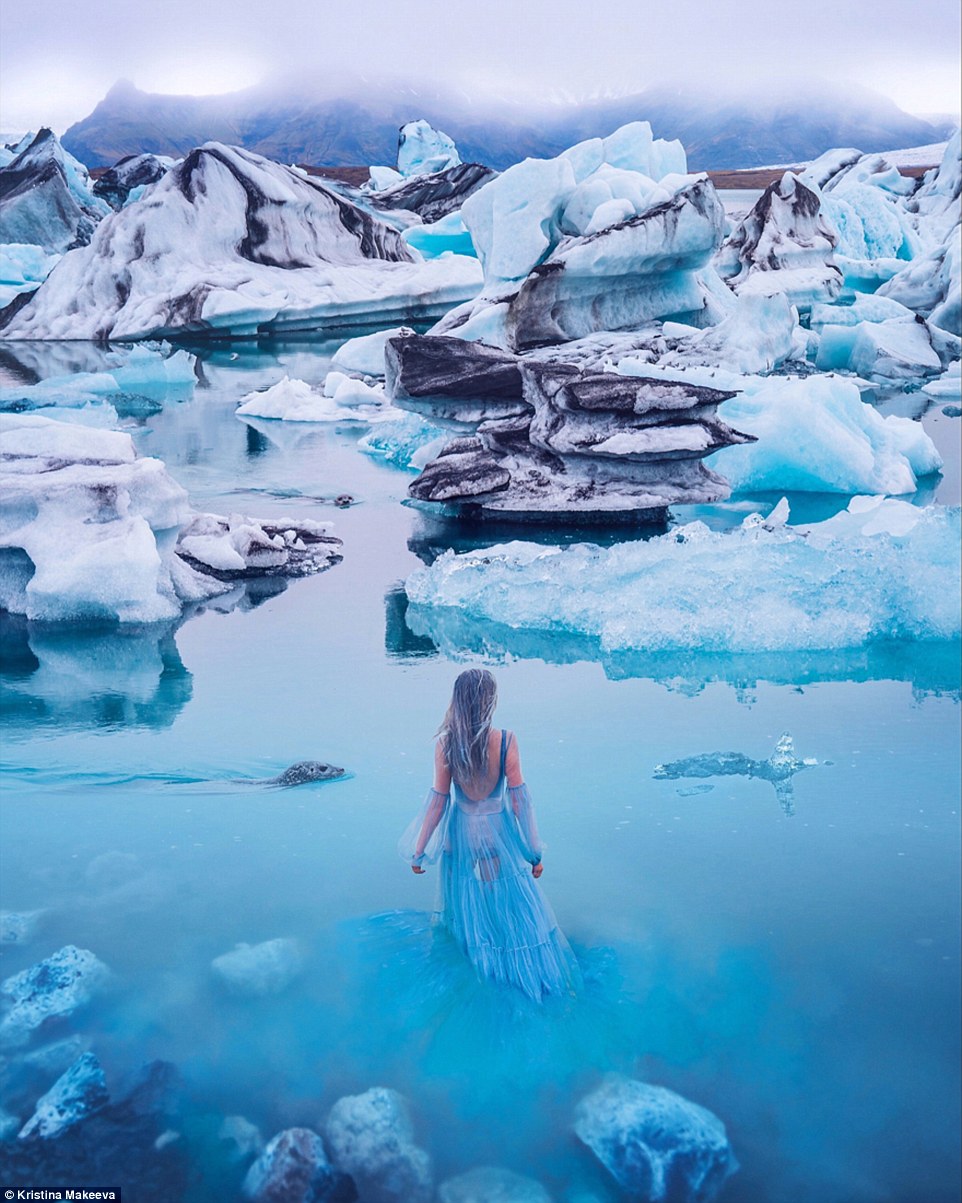In this spectacular shot, a model braves the waters of the Glacier Lagoon in Iceland wearing a dress that matches the colour of the water