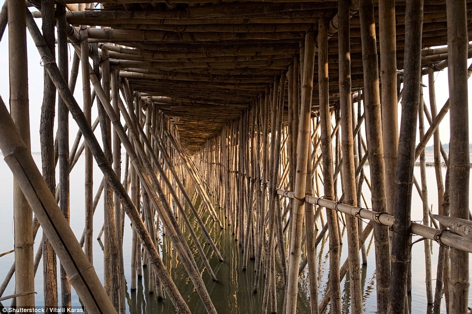 The amazing bridge links the town of Kampong Cham with 1,000 families on Koh Paen across the Mekong River