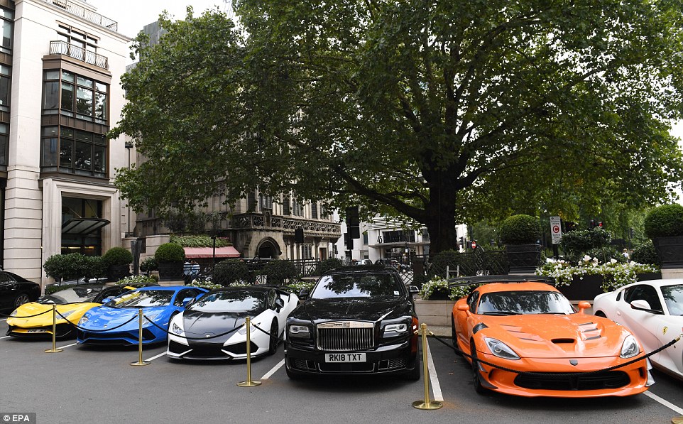 These are just some of the supercars spotted outside the hotel today. They include a yellow Lamborghini Aventador SV Roadster (about £315,000), a blue Lamborghini Aventador (about £270,000), a black and white Lamborghini Huracan (about £180,000), a Rolls-Royce Ghost (about £240,000) and an orange Dodge Viper (around £150,000)