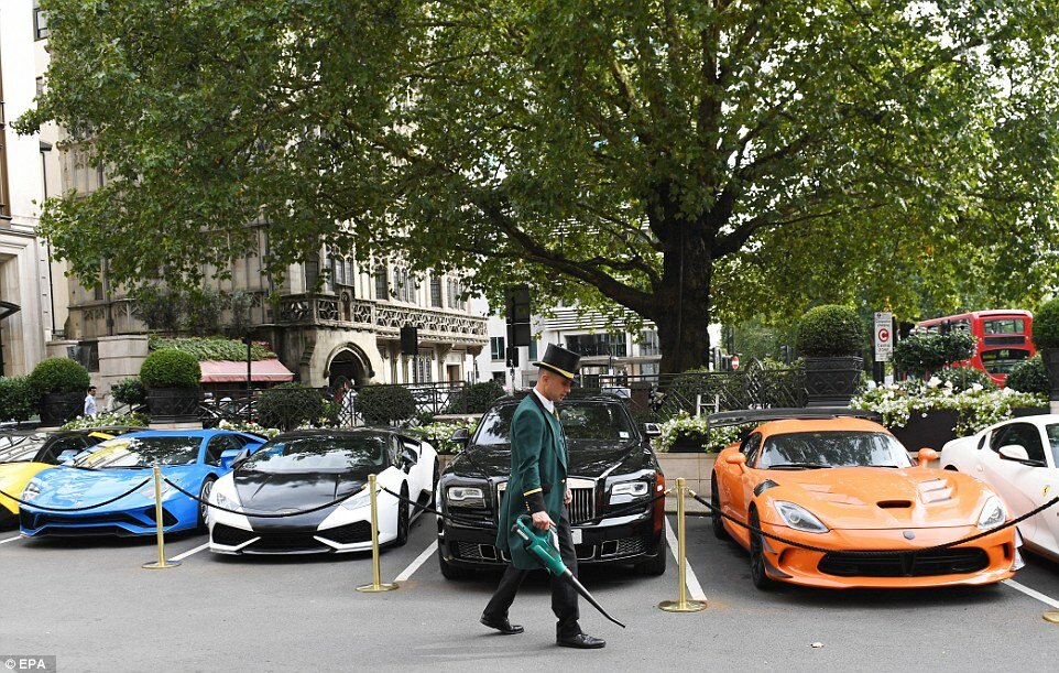 A doorman from the Dorchester hotel in central London keeps precious supercars safe from foliage with his trusty leaf blower. Around July and August each summer, car enthusiasts from countries such as Saudi Arabia, Qatar and Kuwait have their cars flown over to London to show them off and have some fun