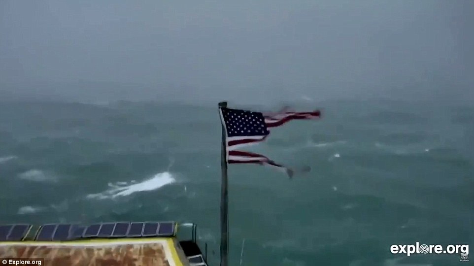 At Frying Pan Tower, an observation post 32 miles off of the coast of North Carolina, a live video feed showed the Category 2 storm's 100mph sustained winds ripping an American flag to shreds on Thursday 