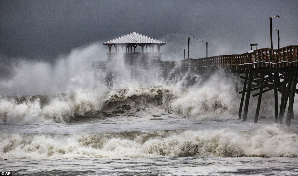 Waves slam the Oceana Pier & Pier House Restaurant in Atlantic Beach, North Carolina as Hurricane Florence approaches the area on Thursday