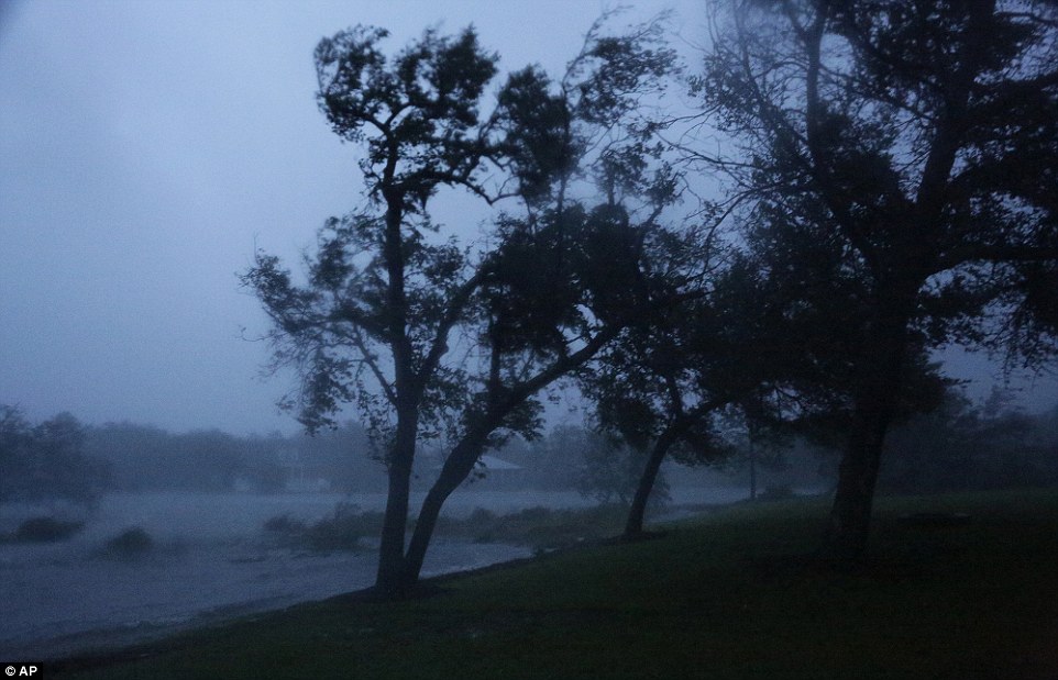 Visibility is poor around the eye of the storm, as water and other debris is pulled up into the air by the wind, as seen in this image of Swansboro on Friday 