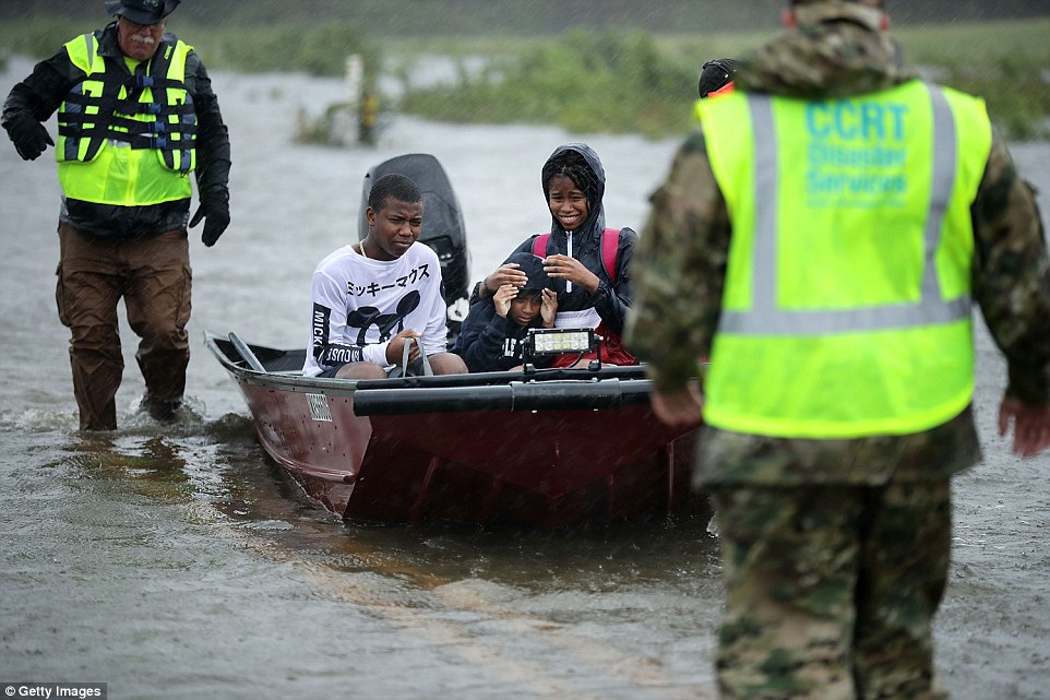 The volunteers moved the three James City children to safety on Friday along a flooded highway in a motorboat. Hundreds of other people have had to call for emergency rescues in the area around New Bern, North Carolina 