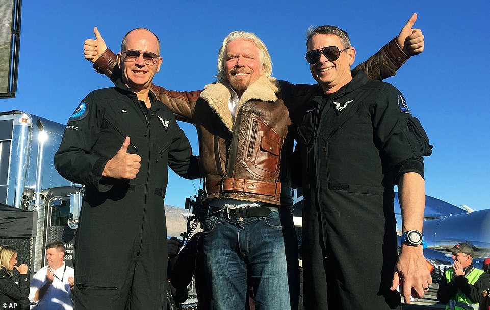 Richard Branson (center) celebrates with pilots Rick CJ Sturckow (left) and Mark 'Forger' Stucky (right) after Virgin Galactic's first successful test to the edge of space in December