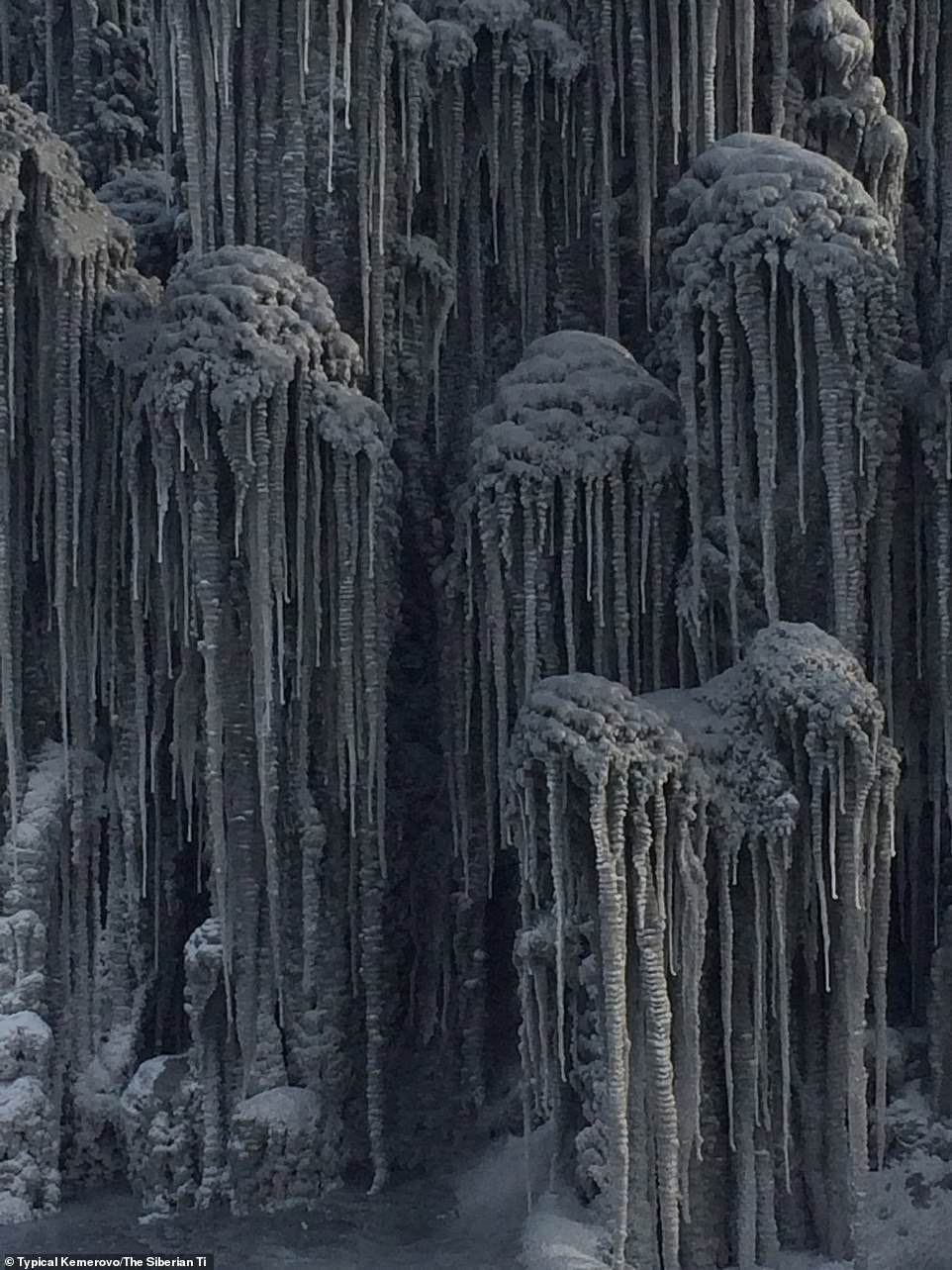 Icicles from a frozen ice fountain in the Kemerovo region were also covered in black soot and left this eerie formation