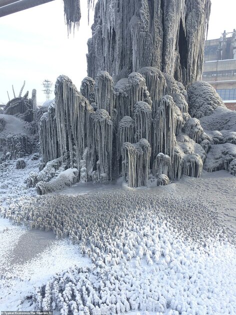 Creepy: Another frozen ice fountain in the Kemerovo region was left with the black and grey covering from pollutionÂ 
