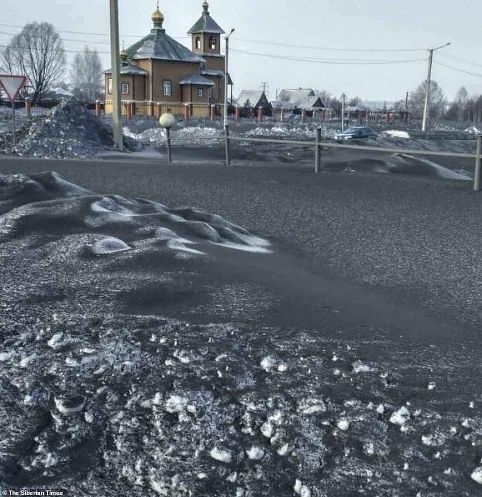 Fields roads and parks have been blighted by the dirty covering of snow from nearby coal plants and processing centresÂ 