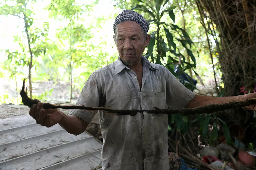 رجل فيتنامي نغوين فان شين البالغ من العمر 92 عاما، لم يقم بقص شعر منذ أكثر من 70 عاما، 21 أغطسطس/ آب 2020