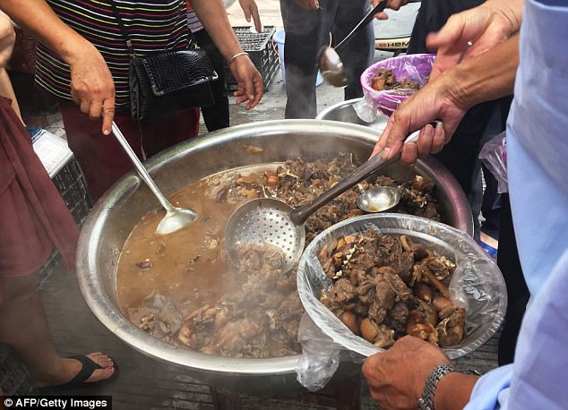 Dog meat is served at a restaurant in Yulin, in China's southern Guangxi region, on June 21
