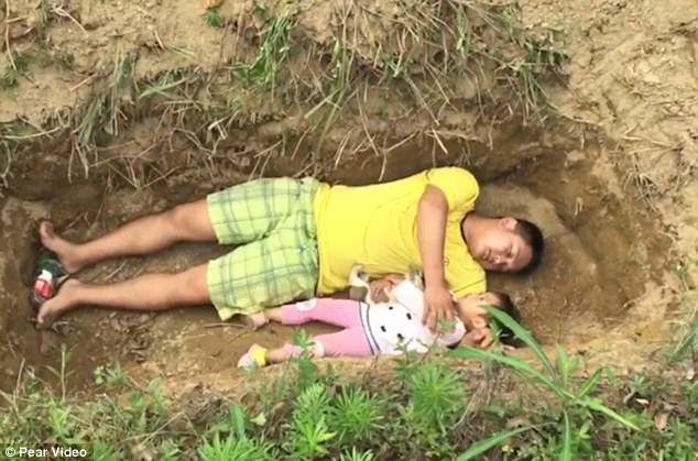 Mr Zhang Liyong, a farmer from China, has dug the grave for his critically ill toddler girl