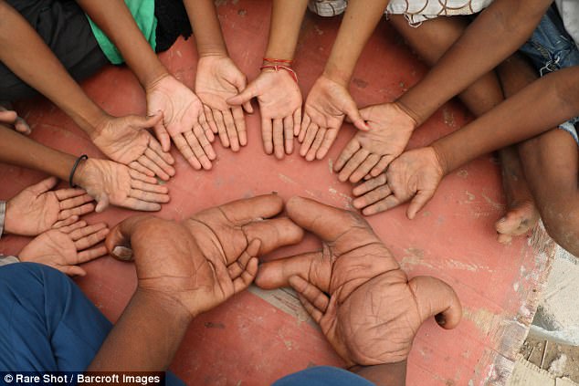 He is called the 'devil' by local villagers who believe his large hands are the result of a curse