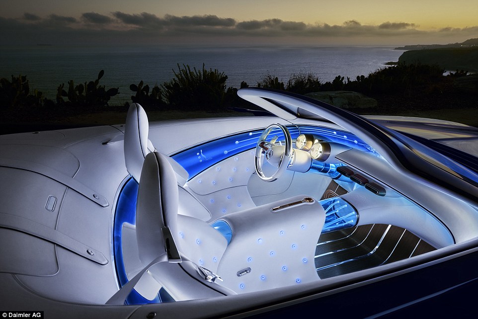 The interior is lavished in white leather that's crafted in the same way as high-end furniture and a blue fibre-optic panel that wraps around the entire cabin of the car