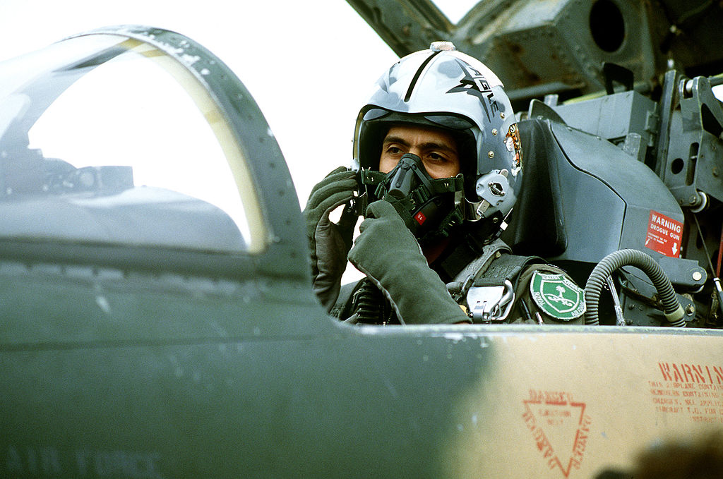Pilot in the Royal Saudi Air Force controlling the oxygen mask, while in the cockpit of the plane -5 F Tiger II