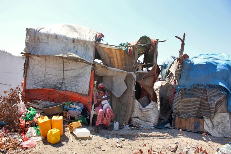 Ethiopian refugees are pictured at a camp for migrants of African origin in the Khor Maksar district of Yemen's second city of Aden on March 3, 2022. (Photo by Saleh OBAIDI / AFP)