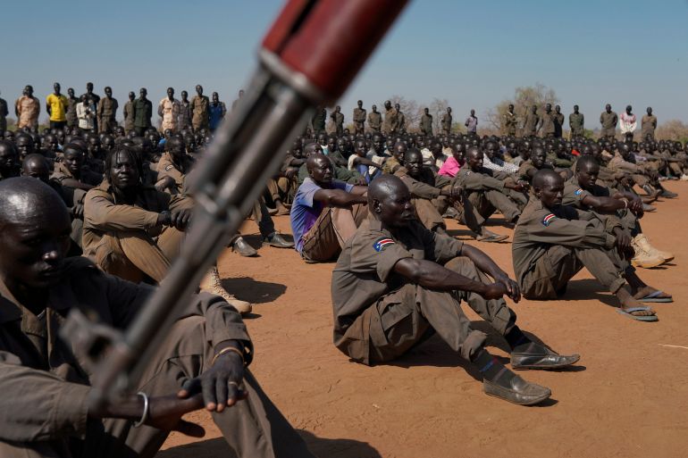South Sudan soldiers gather at the training site for the joint force to protect VIPs in Gorom outside Juba